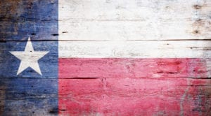Texas state flag painted on old barnwood