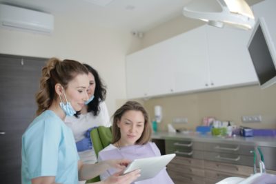 Oral surgeon Talking to a Patient