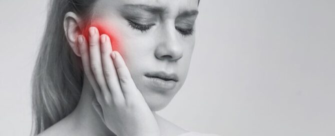 woman suffering from tooth pain